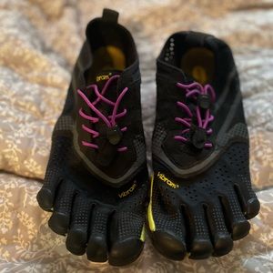 Vibram, fits like woman’s 8